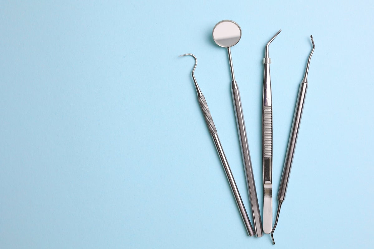 Dentist's tools and a dental model of teeth